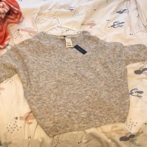 A light grey sweater